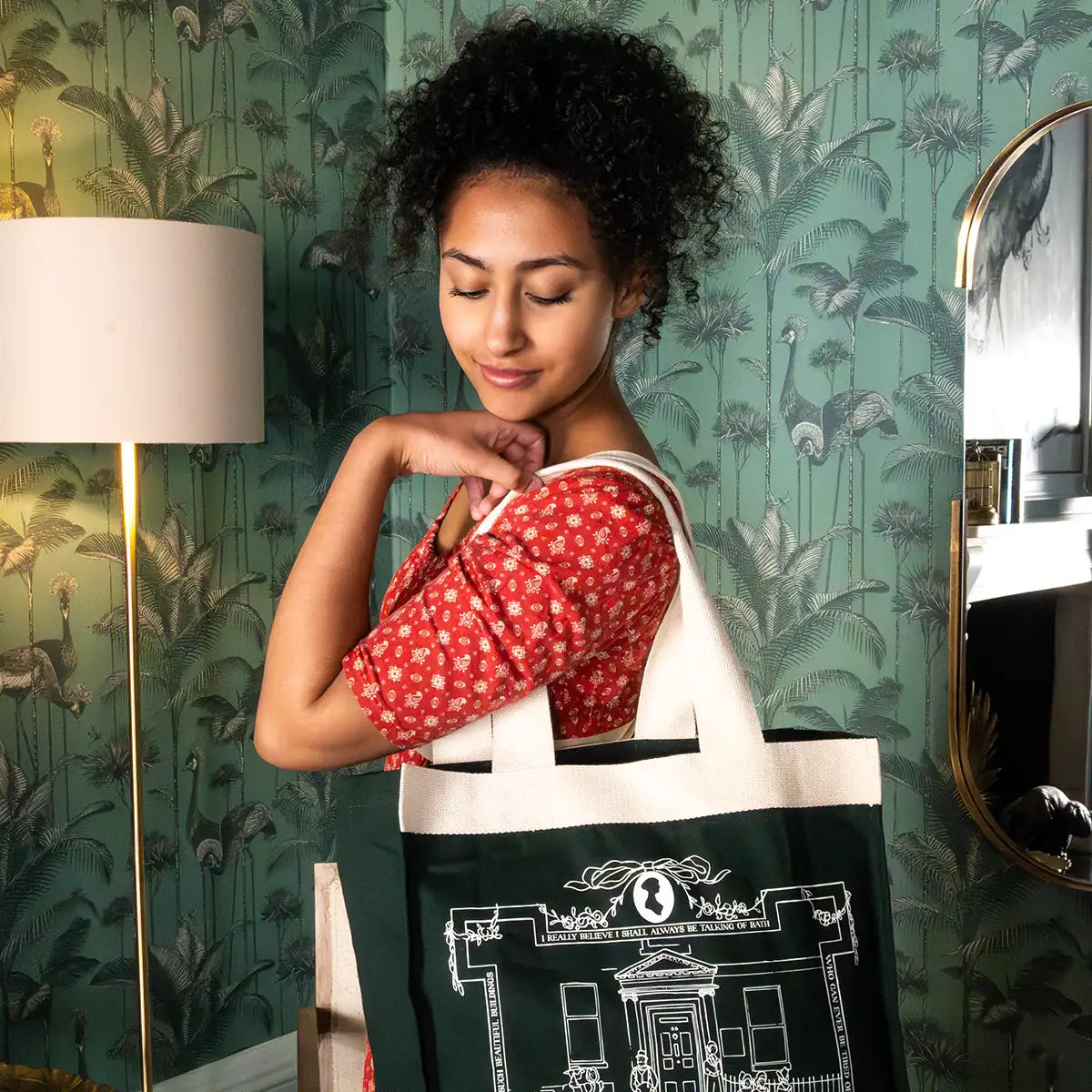 Model posing with a green tote bag on her shoulder. Image taken in the Queensberry Hotel, Bath.