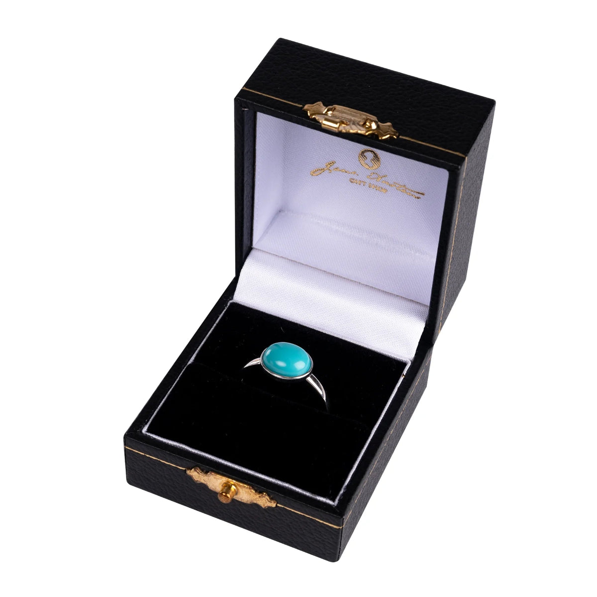 A silver ring with a turquoise stone, displayed in an open black box with gold trimmings, branded with the Jane Austen Centre.