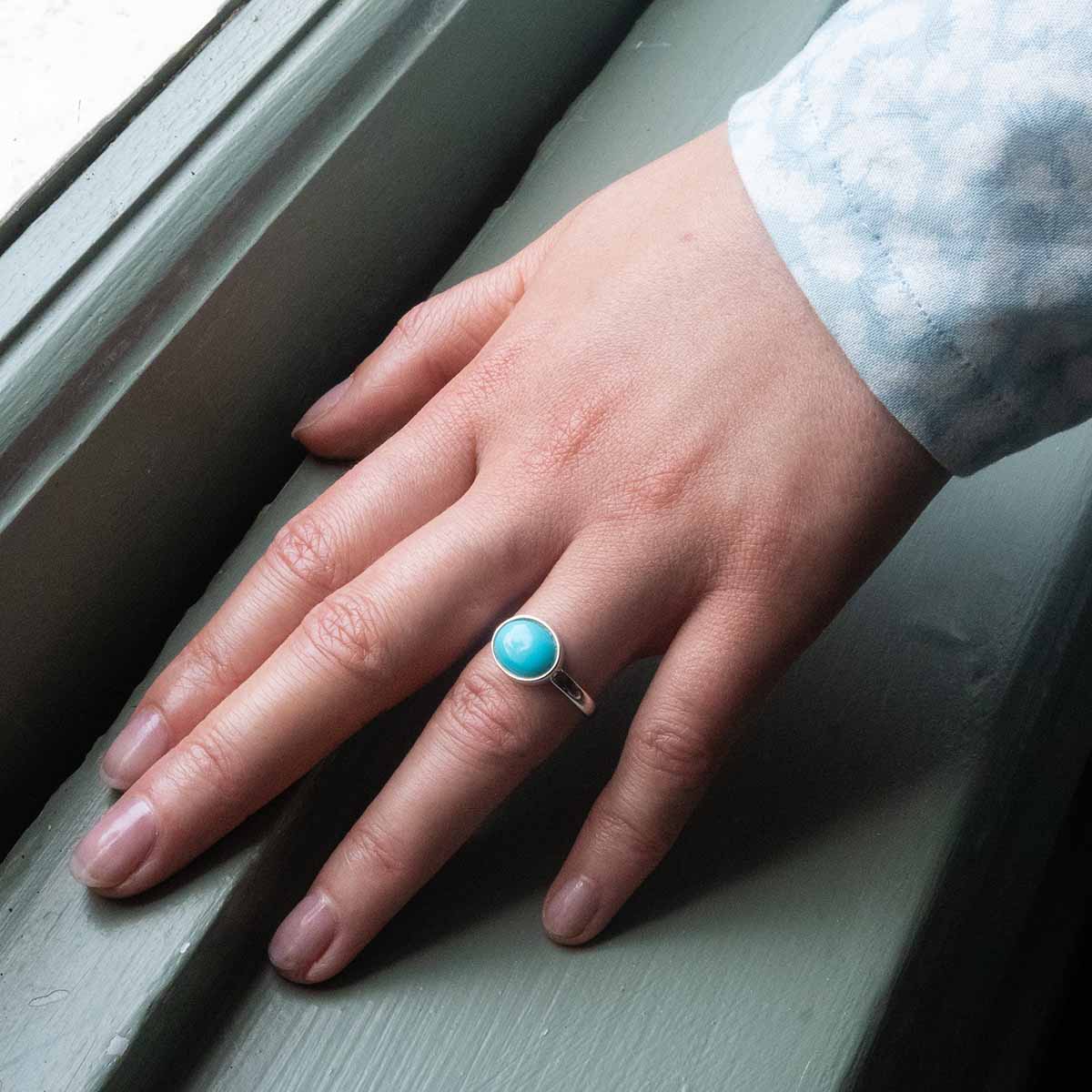 Ring in lifestyle setting - worn on hand.