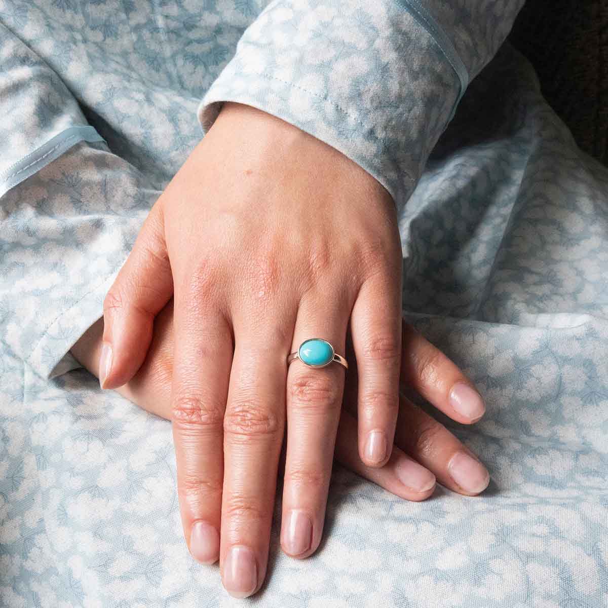 Silver Replica Ring on a finger.