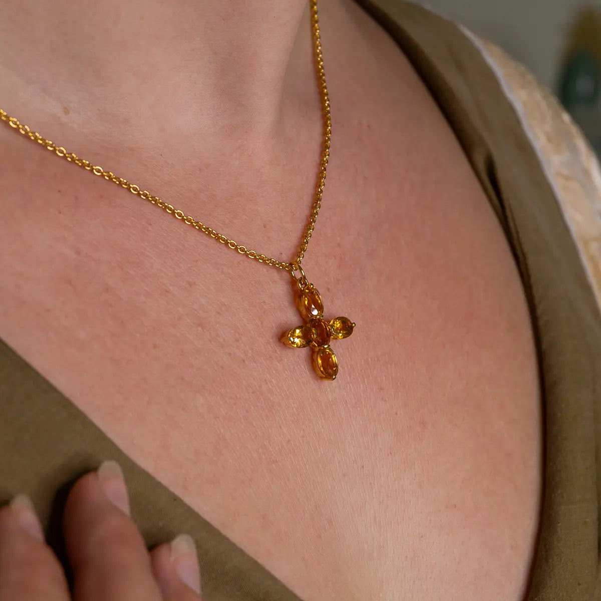 Close up of woman wearing Jane Austen Cross Replica Necklace