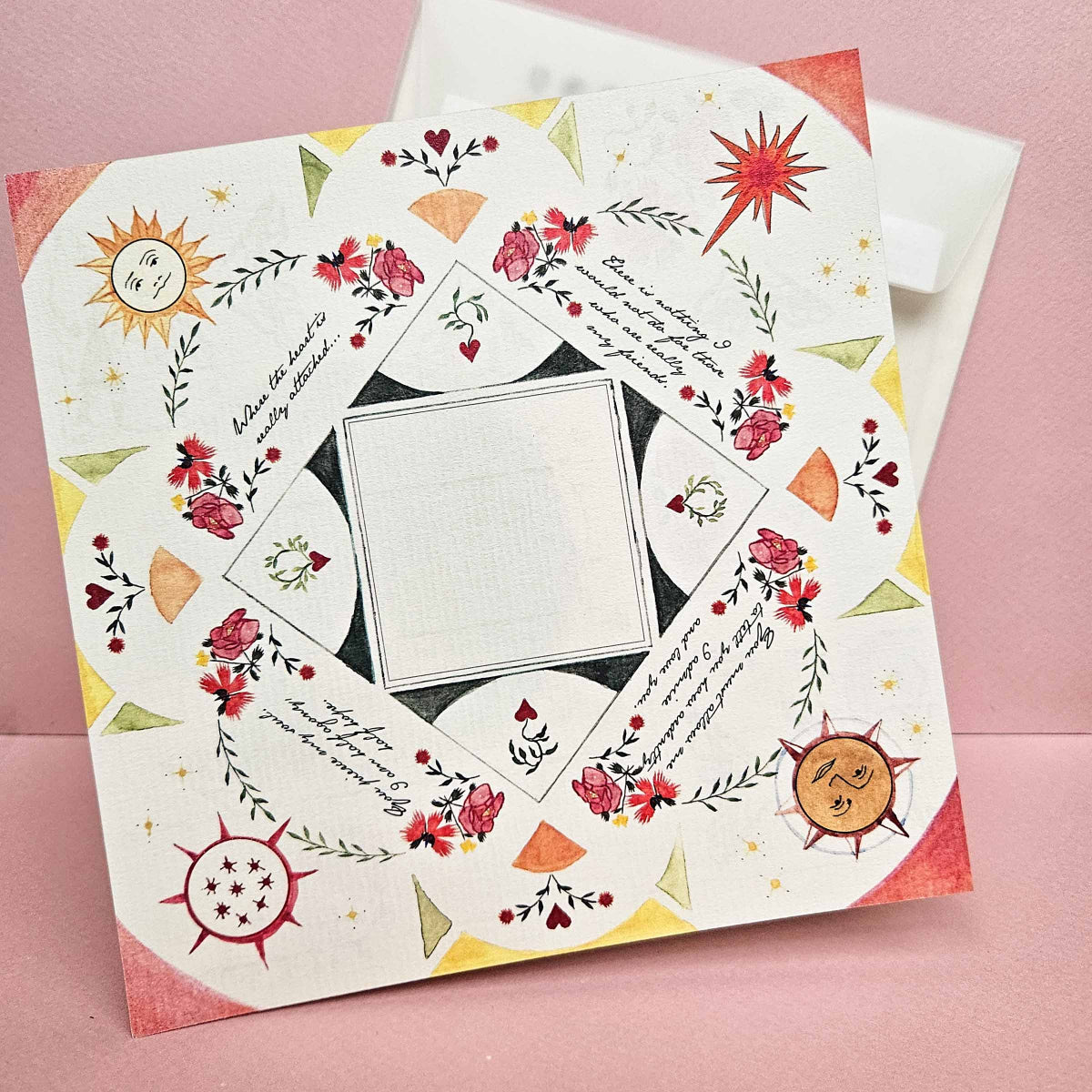 Decorative paper with floral and geometric design on a pink background