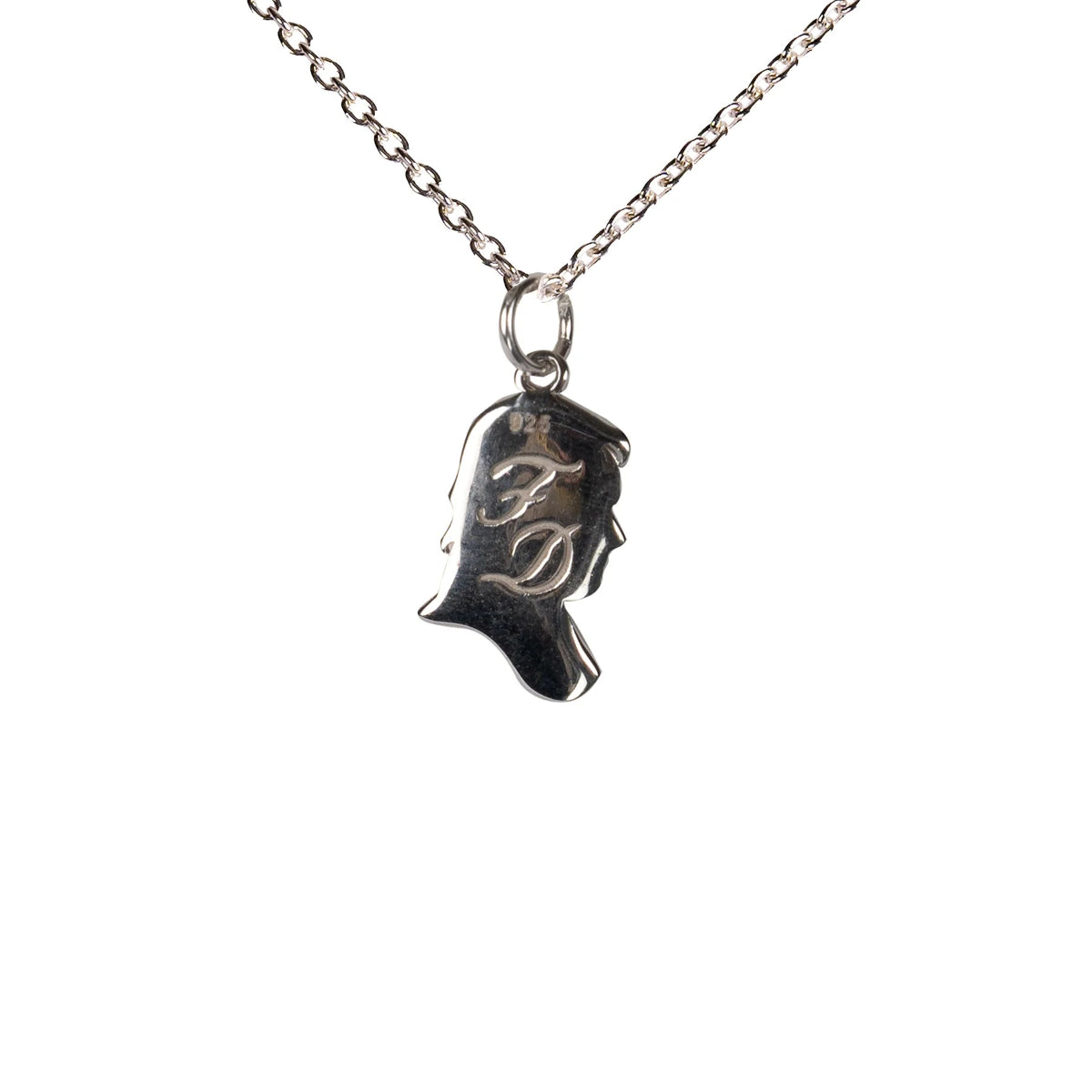 A sterling silver necklace with a pendant featuring the inscribed silhouette of Mr. Darcy, on a white background.