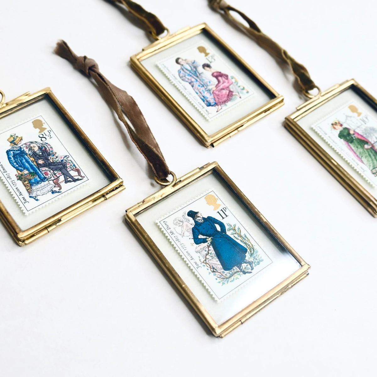 A set of Jane Austen Vintage Stamps set in Brass Frames