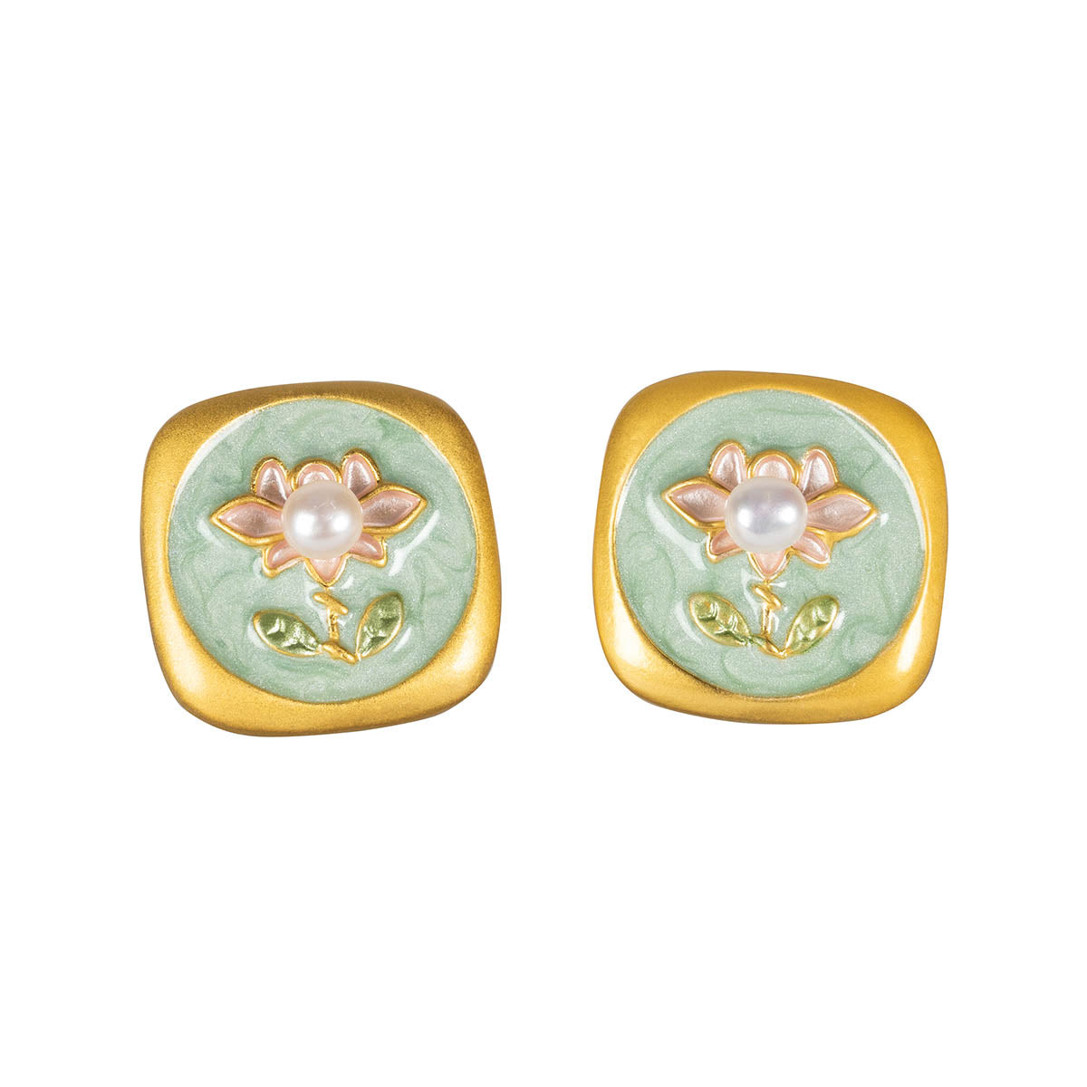 Close up of Two earrings inspired by regency era decor. Gold Borders with light green inner featuring a Flower and pearl as the centre of it.