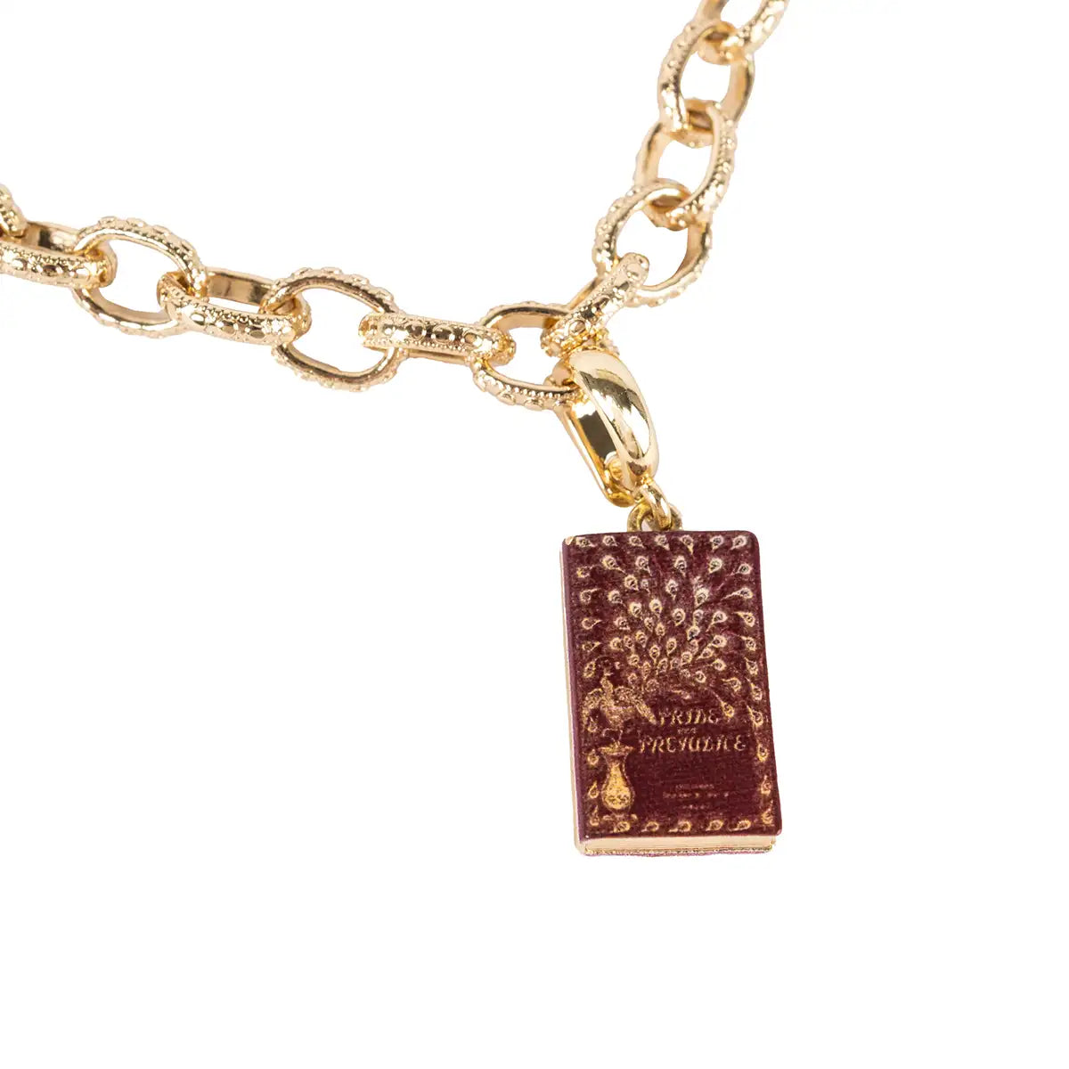 Gold chain bracelet with a book-shaped pendant on a white background