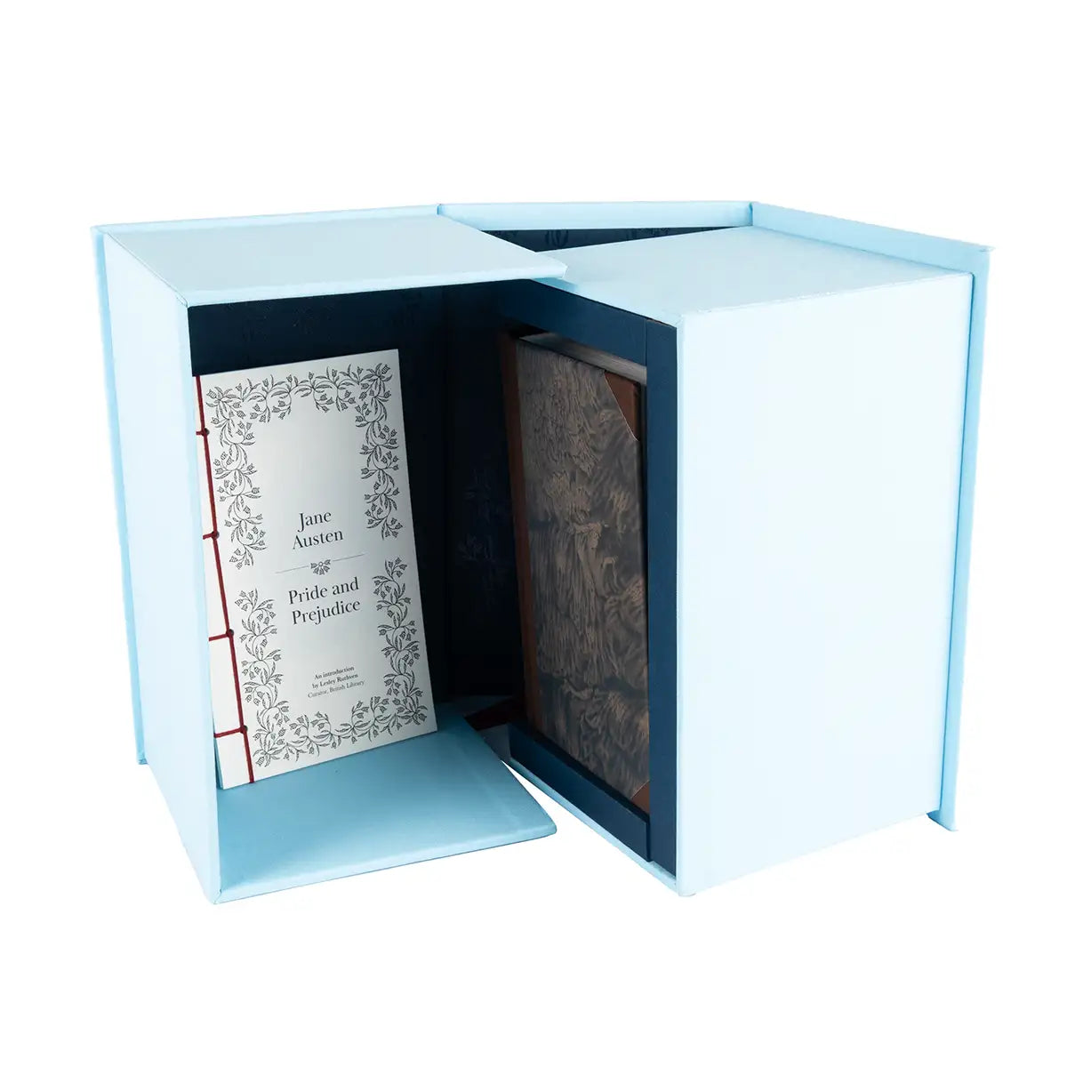 Open box showing three books and one letter-like book