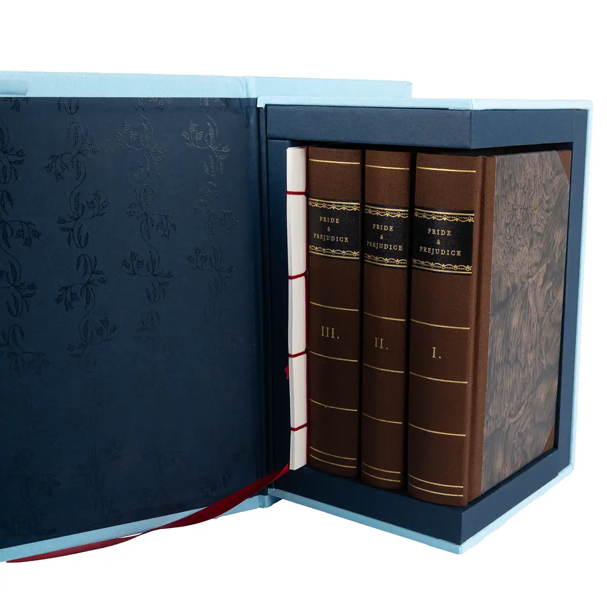 Set of three books with decorative brown cover in a navy box