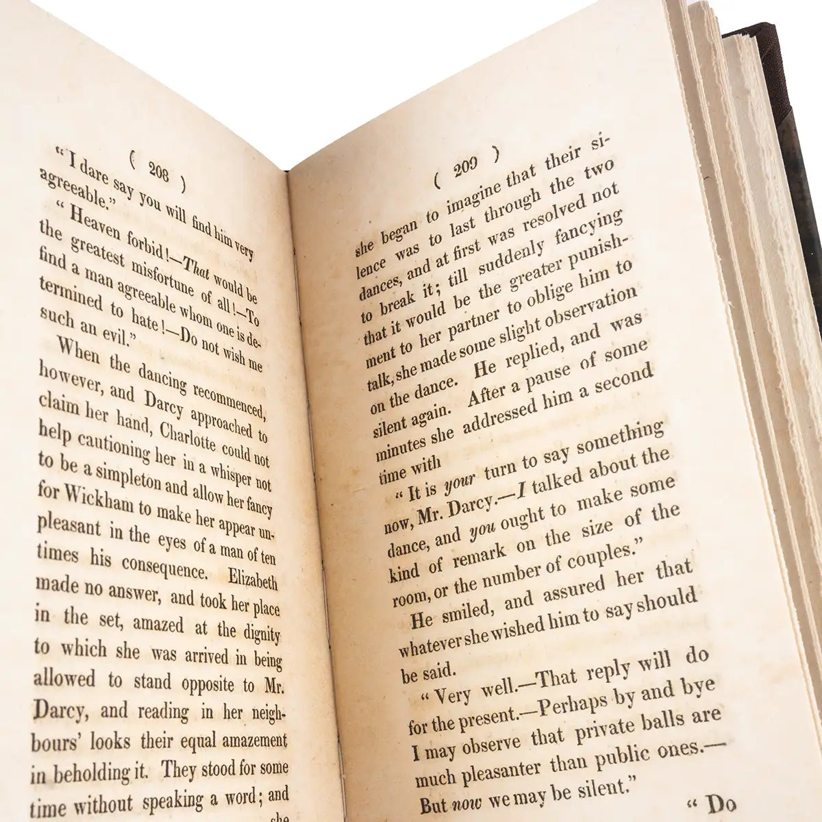 Open book with text on a white background