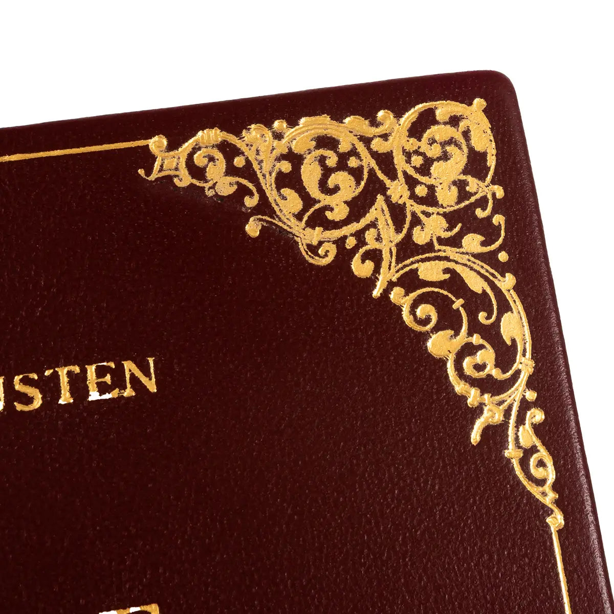 Close up on hand-stamped details on cover of Pride and Prejudice Book Clutch Bag Burgundy leather