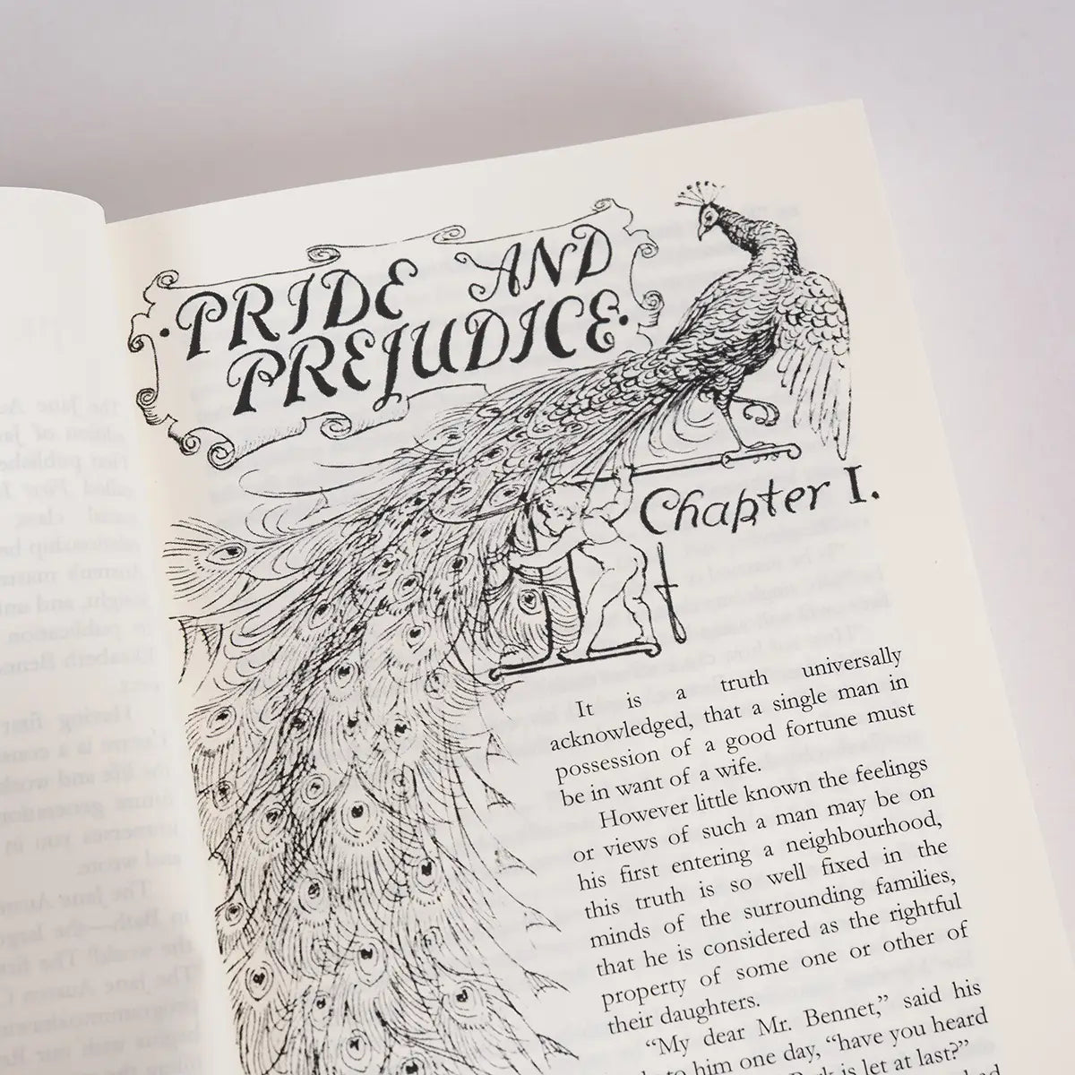 The first page of the Jane Austen Centre edition of Pride and Prejudice featuring the iconic peacock illustration from the first edition