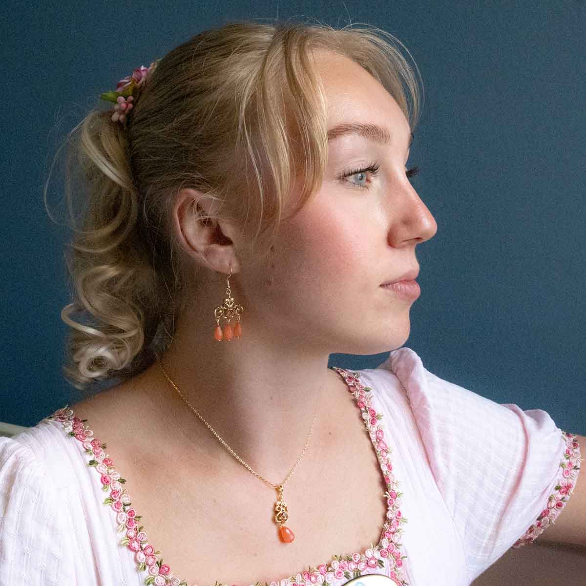 Emma Woodhouse in the Jane Austen Centre modelling the Regency Coral Necklace and Earrings.