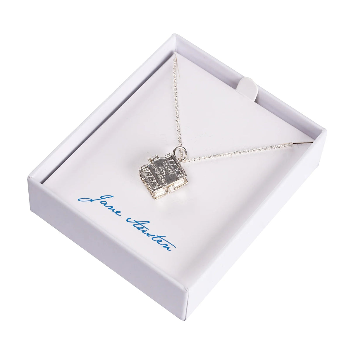 A silver book charm necklace with a Jane Austen book, presented in a white gift box with a sterling silver chain.