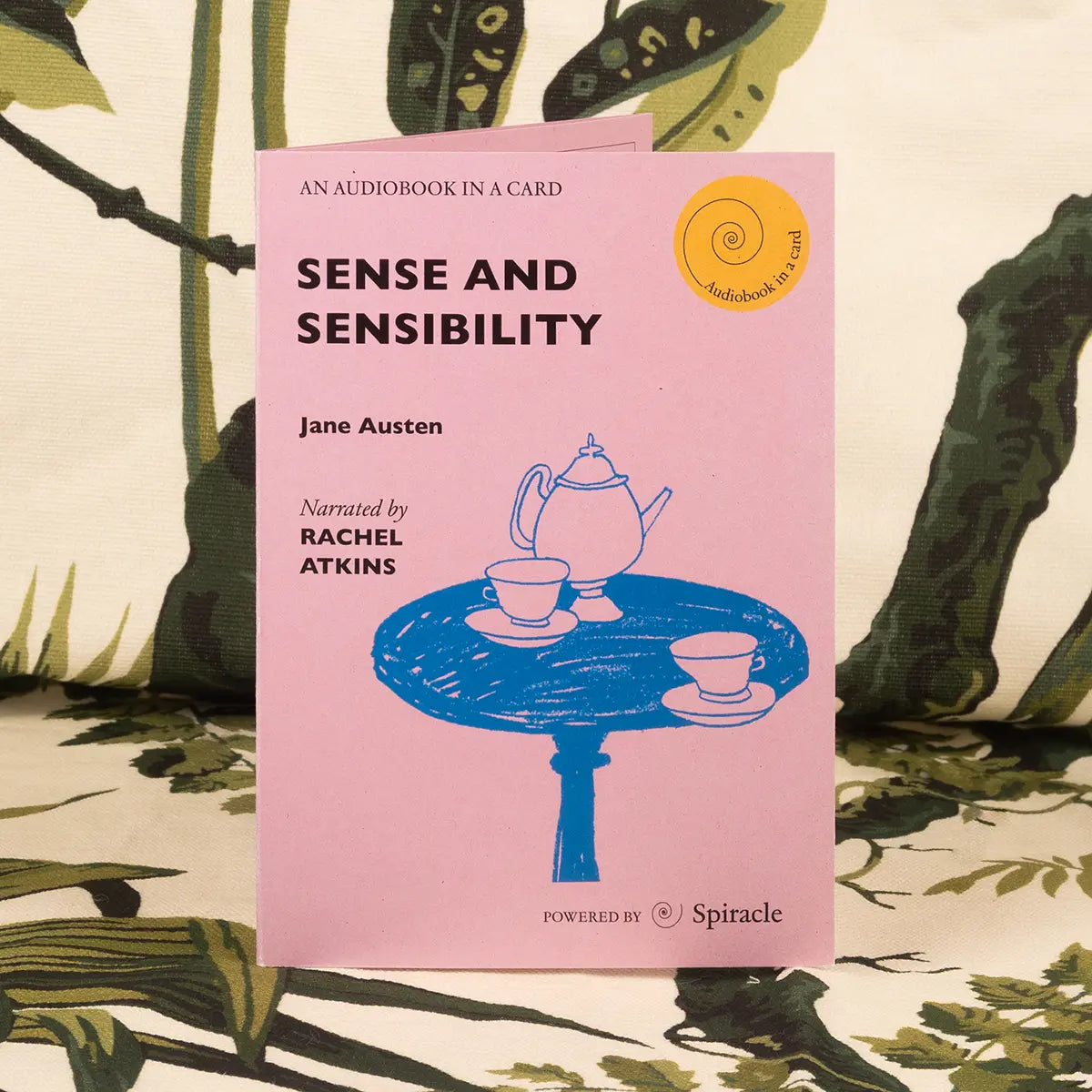 Audiobook card of sense and sensibility against a green forest background