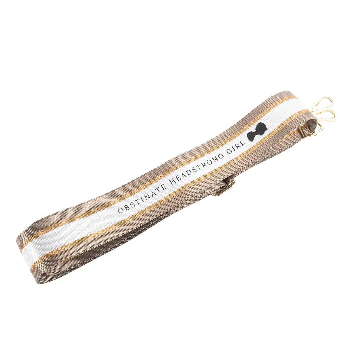 Shoulder strap with 'Obstinate Headstrong Girl' text and a beige and gold design - photographed on a white background.