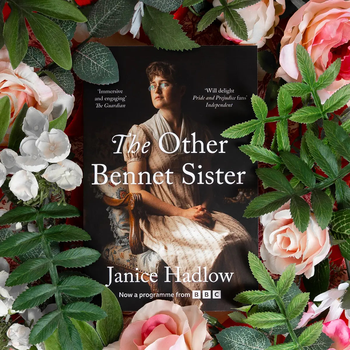 Front cover for Janice Hadlow's novel The Other Bennet Sister against a floral background