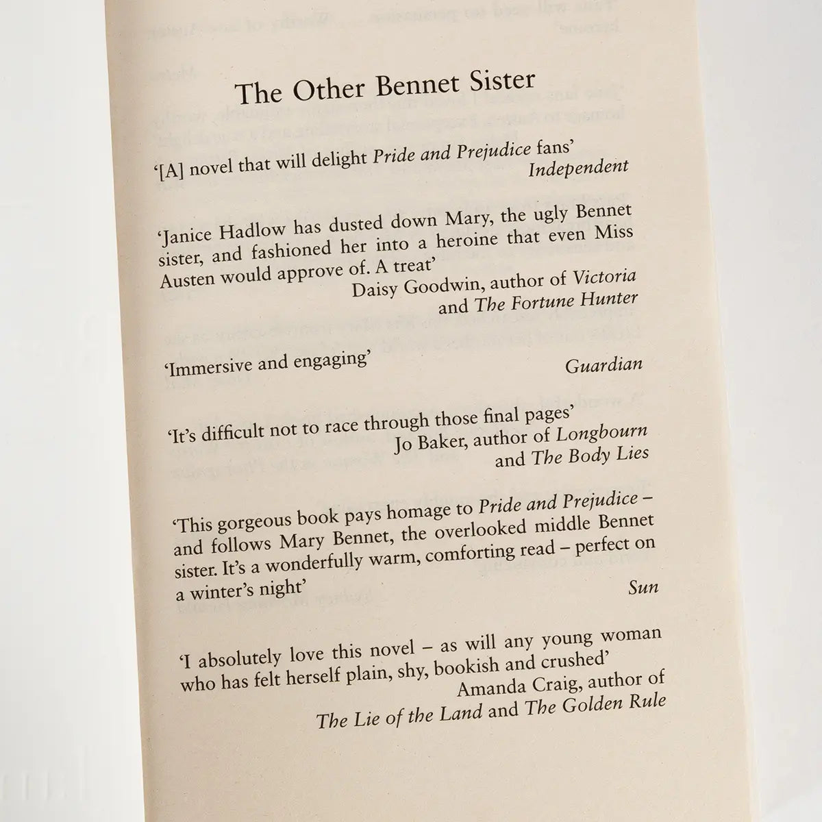 Interior page of Janice Hadlow's novel, The Other Bennet Sister, featuring praise from outlets such as The Guardian and The Independent, and other writers of historical fiction—including Jo Baker and Daisy Goodwin
