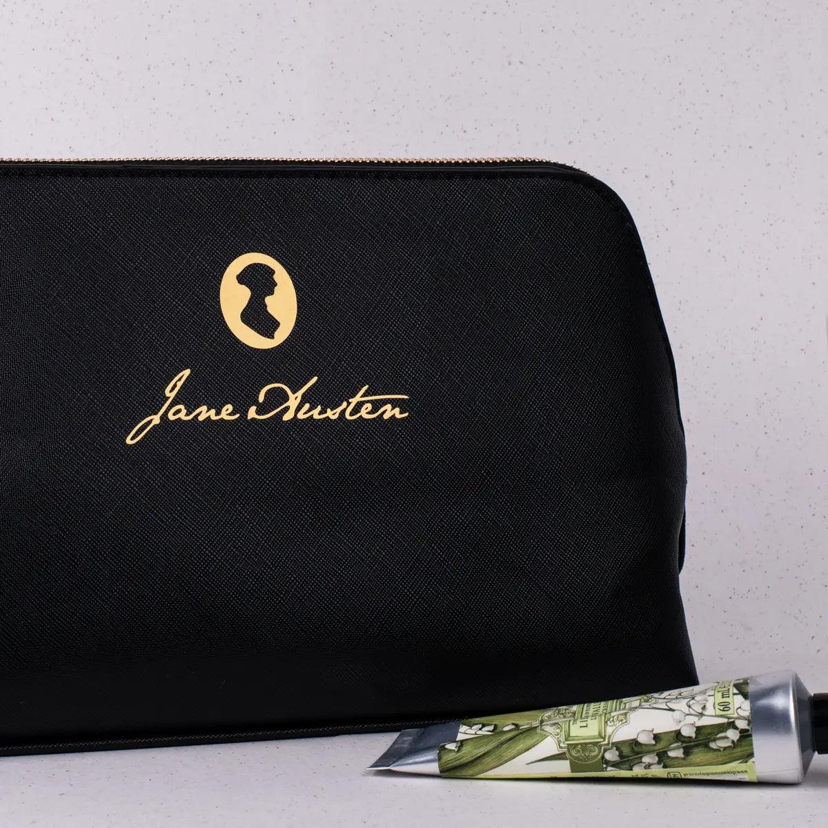 A faux leather cosmetics bag with Jane Austen's iconic signature and silhouette.