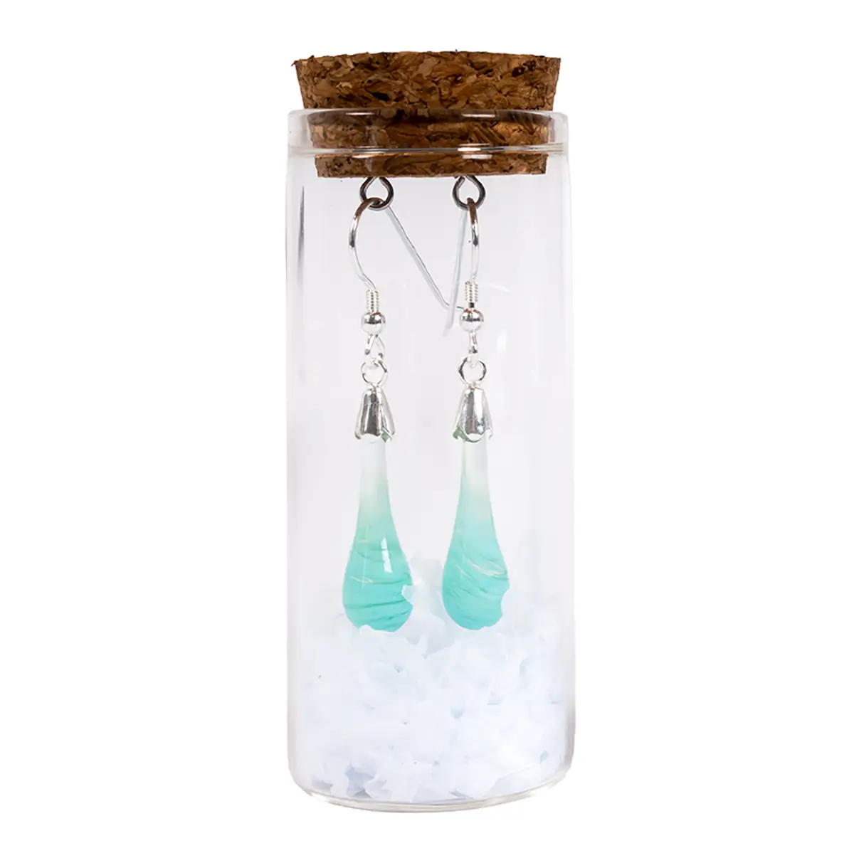 mint coloured drop earrings in a glass tube with a cork stopper and paper shreddings