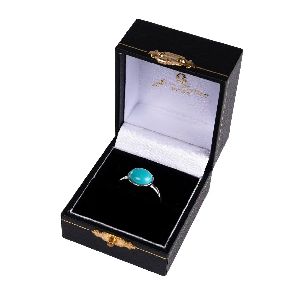 A silver ring with a turquoise stone, displayed in an open black box with gold trimmings, branded with the Jane Austen Centre.