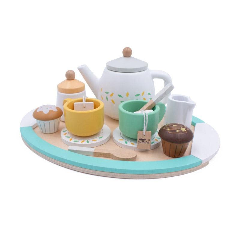 The cute wooden play set is displayed with a white background. you can see all the peices on the wooden tray. A little plain muffin and a chocolate muffin. As well as two coloured teacups with wooden tea bags and teasppons. And behind these, is a sugar pot, a milk jug and a daintily decorated tea pot. This lovely set is perfect for any little ones wanting a little bit of safe an imaginative play 