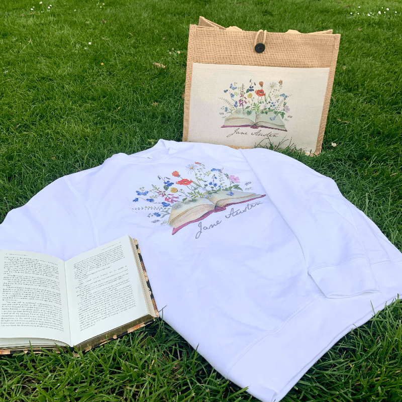 Wear Jane Austen's iconic signature with our beautiful blossoming books design sweater.   Made from a soft blend of 80% cotton and 20% polyester, the modern design compliments the wondrously classical novels that Jane Austen is famous for. 