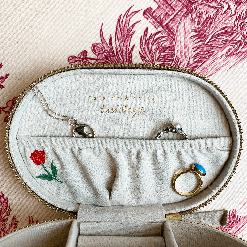 The lid is shown open to display the message on the inside "take me with you", as well as the embroidered tulip within the box. These precise details are perfect for any one wanting to find the perfect place to store their Regency jewellery.