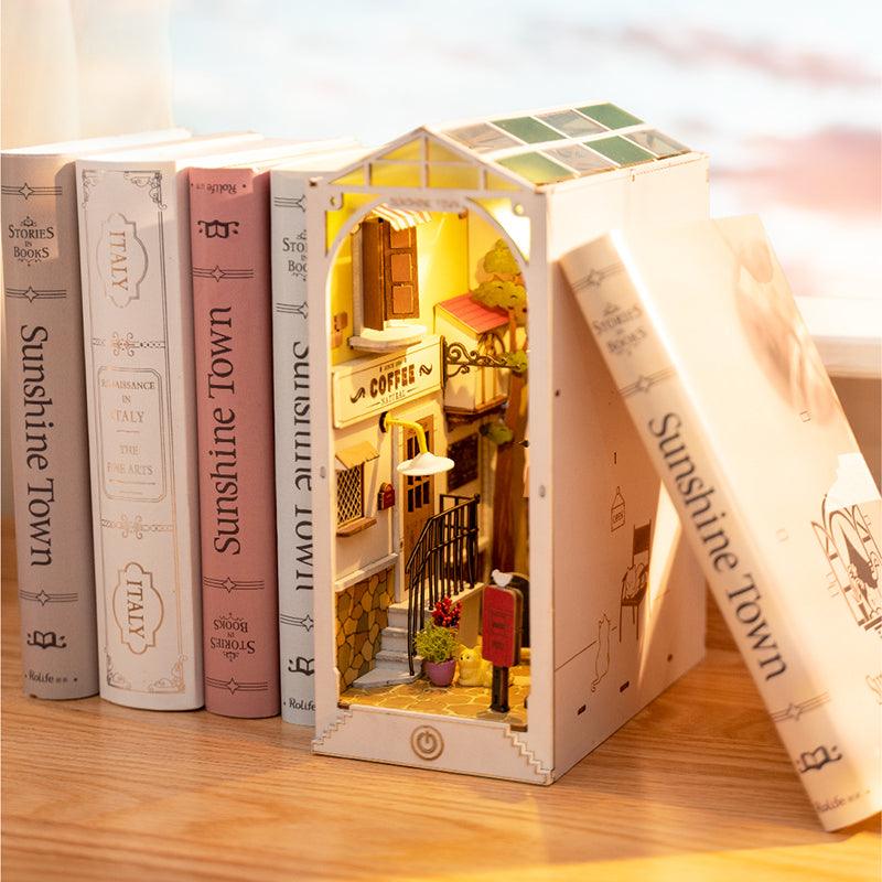 This adorable book nook sits cosily into the bookshelf and is clearly shown here surrounded by books - making it the perfect gift for book lovers 
